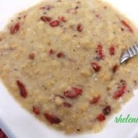 A bowl of oatmeal with goji berries.