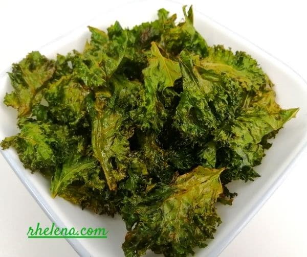 Crispy oven baked kale chips in a bow.