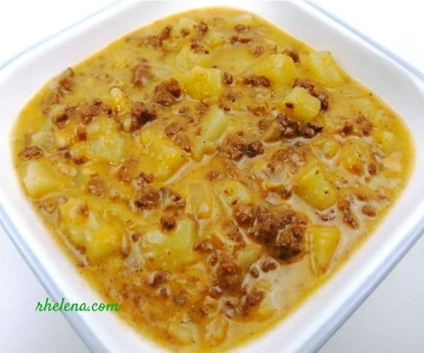 A cheesy ground beef and potato dish shown in a bowl.