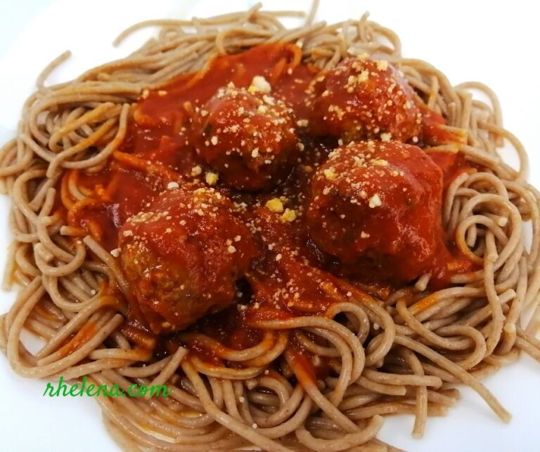 Meatballs shown on einkown spaghetti.
