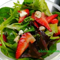 Salad with mixed greens and strawberries.