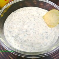 Ranch dip with Greek yogurt shown with a potato chip.