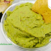Guacamole shown with a corn chip.