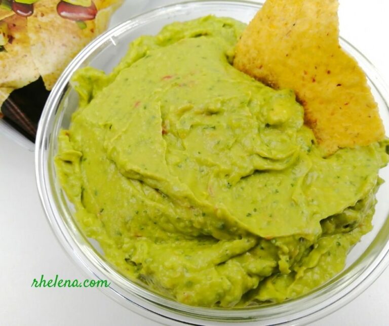 Guacamole shown with a corn chip.