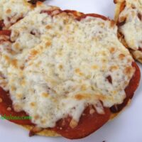 Corn tortilla pizza snack shown on a 5 inch corn tortilla.